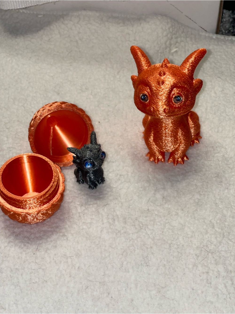 3D Printed Dragon Figures with Orange Metallic Finish